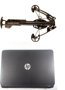 Mini Striker crossbow pistol compared to laptop