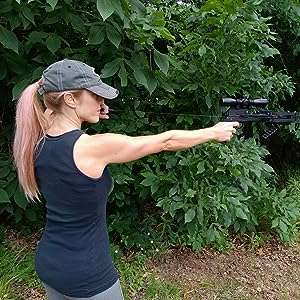 Hot girl aiming with mini Striker pistol crossbow